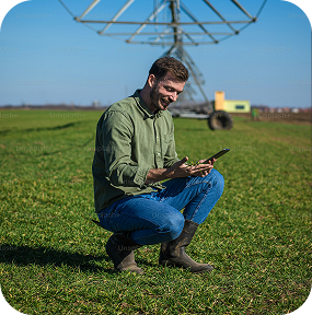 Farmer checking field boundaries on a tablet